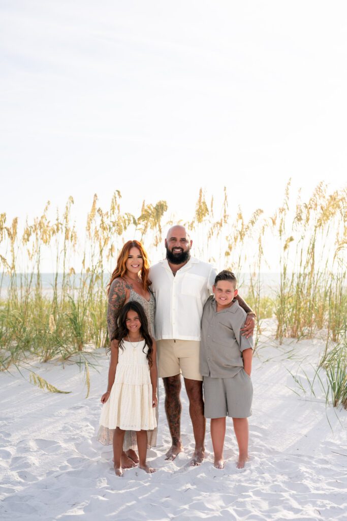 Bean Point Beach family photos in sea oats on Anna Maria Island Florida