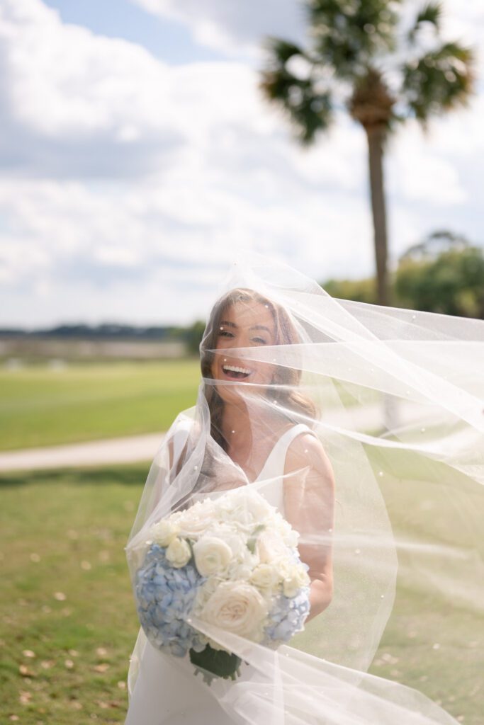 Wind-swept bridal portrait at a Dataw Island wedding in the South Carolina Lowcountry