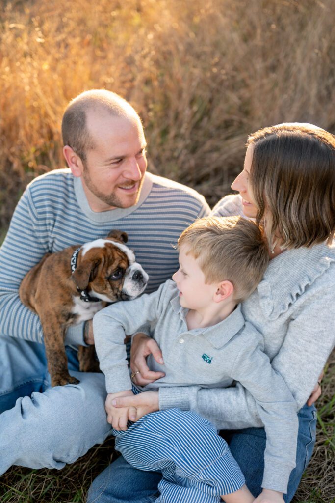Family portraits at Lake Louisa State Park Clermont FL with parents, child, and dog in golden hour light