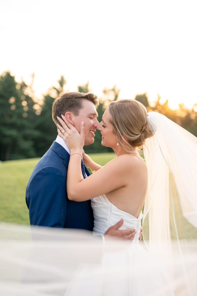 Summit on Cross Mountain wedding photographer capturing sunset portrait of bride and groom in Jefferson NC