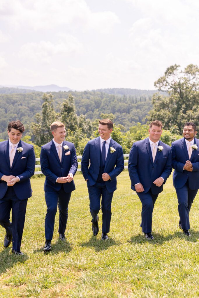 Groomsmen walking together during mountain wedding at Summit on Cross Mountain in Jefferson NC