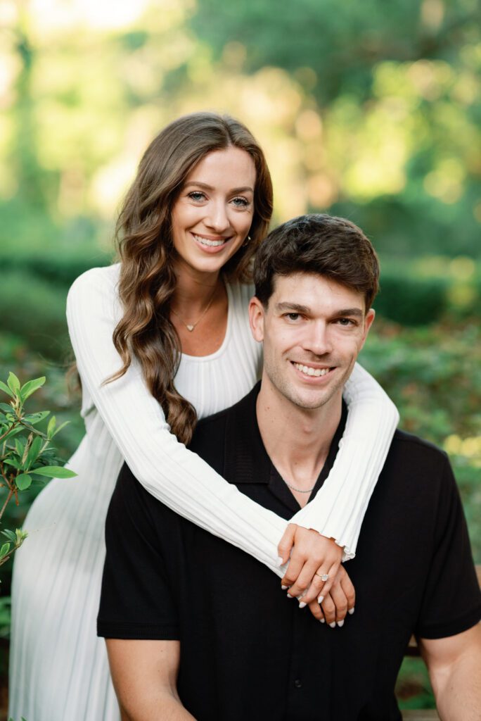 Joyful engagement portrait in lush gardens at Washington Oaks Gardens State Park in Flagler County