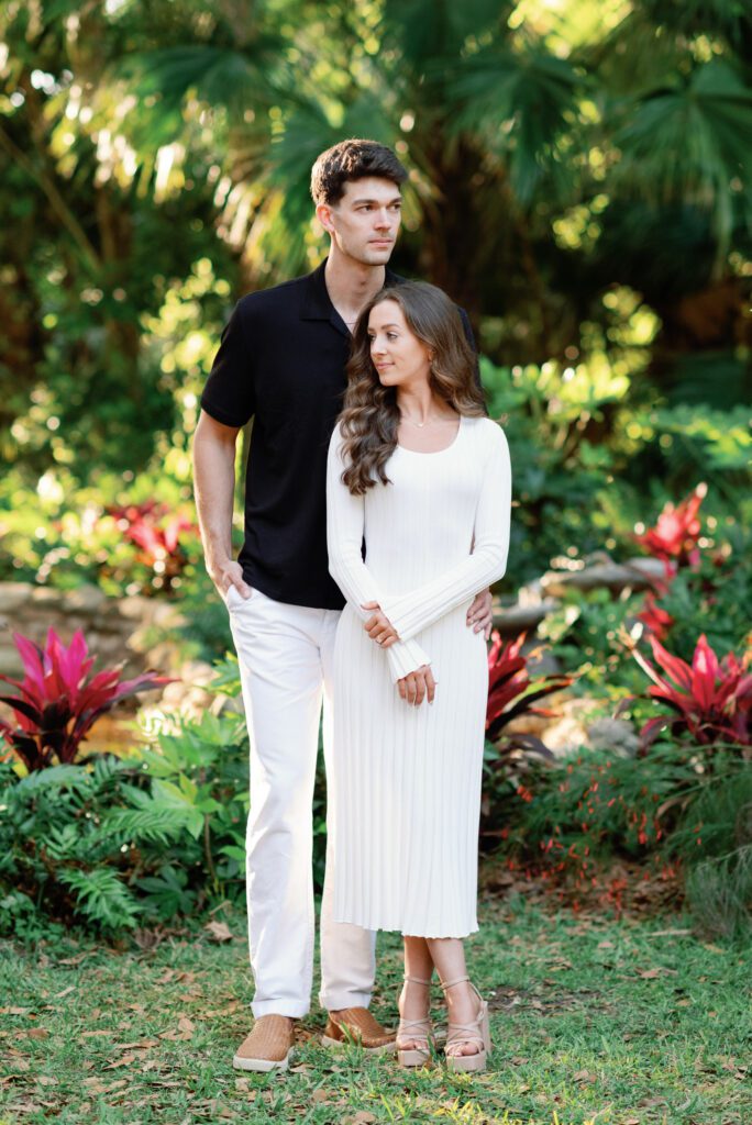 Elegant couple portrait surrounded by tropical greenery during Washington Oaks Gardens State Park engagement photos in Flagler County
