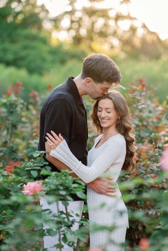 Romantic garden engagement moment surrounded by florals at Washington Oaks Gardens State Park in Palm Coast, Florida