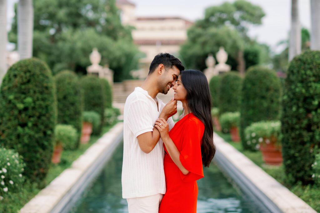 Romantic couple portrait along Worth Avenue in Palm Beach following a Worth Avenue Clock Tower proposal with soft garden architecture backdrop